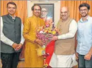  ?? PTI FILE ?? BJP president Amit Shah with Shiv Sena chief Uddhav Thackeray and Maharashtr­a CM Devendra Fadnavis on Wednesday.