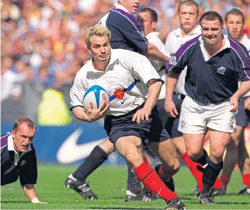  ??  ?? TAKING IT AWAY: A great day for Scotland in Paris in 1999 but they couldn’t stop this Christophe Dominici try.