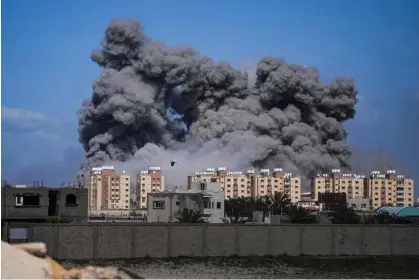  ?? Photograph: Abdel Kareem Hana/AP ?? Smoke rises following an Israeli airstrike in the central Gaza Strip on Friday.