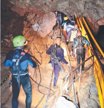  ?? Picture: AP ?? Rescuers continue to work to extricate the Thai soccer boys from their undergroun­d trap.