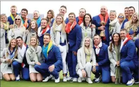  ?? The Associated Press ?? Europe team captain Thomas Bjorn holds the trophy as he celebrates with his team and their wives and partners after Europe won the Ryder Cup on the final day of the 42nd Ryder Cup at Le Golf National in Saint-Quentin-en-Yvelines in France, Sunday.