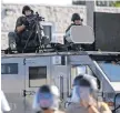  ?? JEFF ROBERSON, AP ?? Police deployed battlefiel­d equipment after violence in Ferguson, Mo., in 2014.