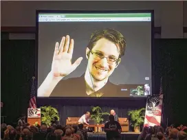  ?? MARCO GARCIA / ASSOCIATED PRESS 2015 ?? Edward Snowden appears on a live video-feed broadcast from Moscow, where he lives in exile, at an event sponsored by ACLU Hawaii in Honolulu, February 2015. Snowden frequently gives online talks and has developed tools to help journalist­s detect...