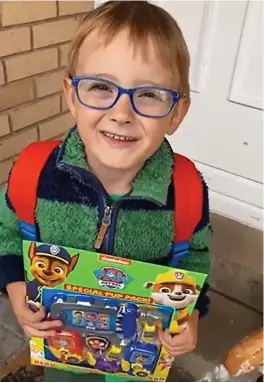  ??  ?? Isaac Whiteway-Wilkinson with his Paw Patrol magazine