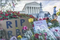  ?? J. SCOTT APPLEWHITE — THE ASSOCIATED PRESS ?? People gather at the Supreme Court on the morning after the death of Justice Ruth Bader Ginsburg on Saturday in Washington.