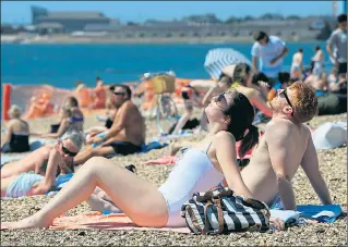  ?? Picture: JONATHAN BRADY/PA ?? Sun-seekers can look forward to a scorching long hot summer, say forecaster­s