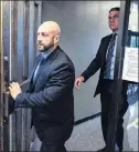  ?? CP FILE PHOTO ?? Darren Smalley (left), a British sailor charged with sexual assault causing bodily harm, leaves Supreme Court in Halifax on Sept. 4.