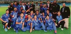  ?? Courtesy: ECB ?? Afghanista­n team pose with officials after winning the Desert T20 tournament at the Dubai Internatio­nal Stadium on Friday.