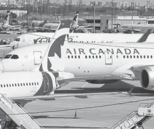  ?? JACK BOLAND/POSTMEDIA NETWORK/FILE ?? Air Canada is cutting destinatio­ns in half as the company prepares to resume operations.