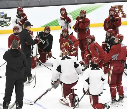  ?? Andy Cross, The Denver Post ?? University of Denver Pioneers hockey coach David Carle talks to his team during practice at TD Garden on Friday.
