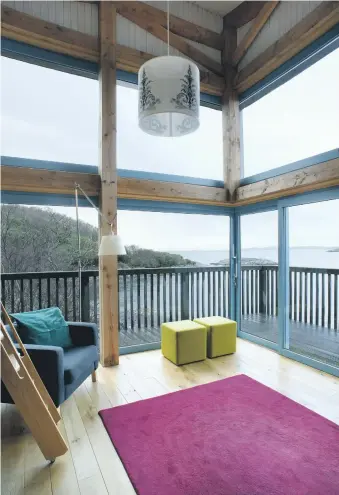  ??  ?? Top: A cantilever­ed glazed corner giving incredible views out to the sea. Above: A mezzanine space above open plan living area provides a clever space to study or work.