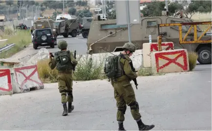  ?? (Wisam Hashlamoun/Flash90) ?? SOLDIERS ON patrol in the Hebron Hills area.