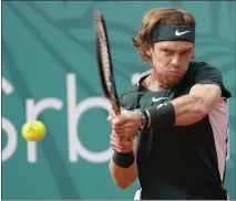  ?? DARKO VOJINOVIC — THE ASSOCIATED PRESS ?? Russia’s Andrey Rublev, above, prevented top-ranked Novak Djokovic from claiming his first title of the year in his home event, the Serbia Open.