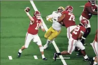  ?? Roger Steinman / Associated Press ?? Alabama quarterbac­k Mac Jones (10) throws a pass under pressure from Notre Dame in the second half.