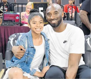  ?? ETHAN MILLER/GETTY ?? Gianna Bryant and her father, former NBA player Kobe Bryant, attend the 2019 WNBA All-Star Game at the Mandalay Bay Events Center on July 27, 2019, in Las Vegas, Nev. Gianna and Kobe were killed in a helicopter crash Sunday that also took the lives of seven other people.