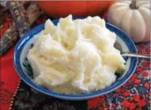  ?? PHOTO BY EMILY RYAN ?? Cream cheese, sour cream, milk and butter make these mashed potatoes extra-indulgent.