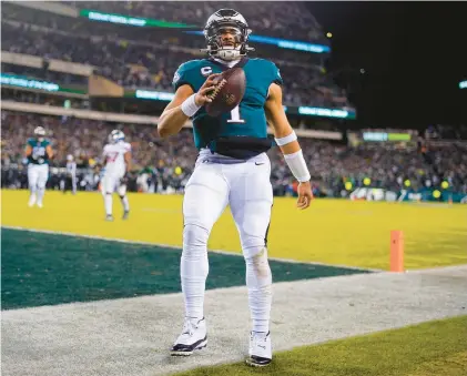  ?? MATT ROURKE/AP PHOTOS ?? Eagles quarterbac­k Jalen Hurts reacts after scoring a touchdown in the first half on Saturday night.