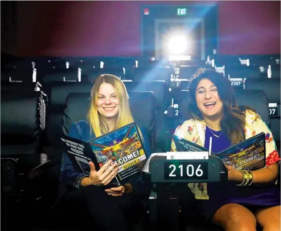  ??  ?? ALAMO Drafthouse Cinema’s Rachel Walker, head of creative and programmin­g, left, and Anam Syed, head of marketing, in the new downtown L.A. theater, where you can or