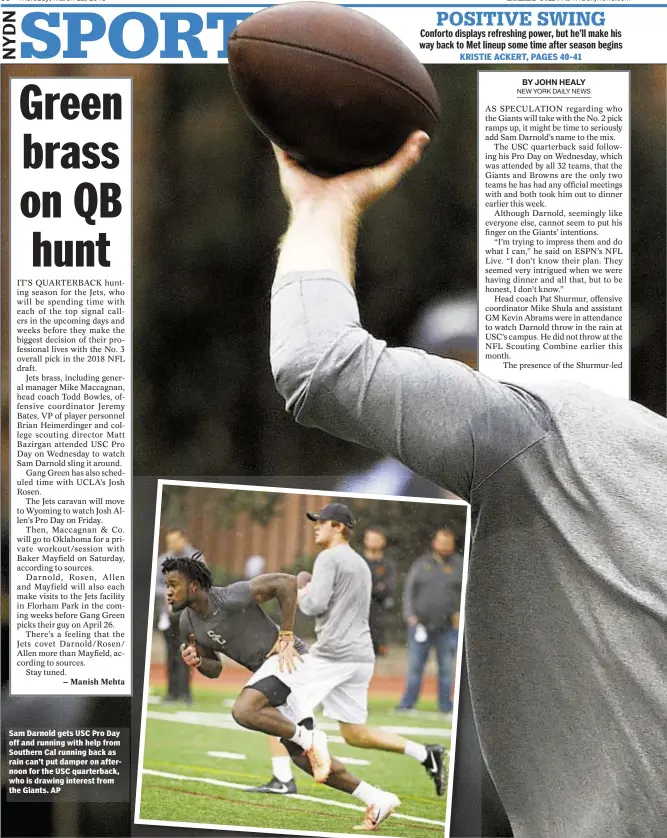 ?? AP ?? Sam Darnold gets USC Pro Day off and running with help from Southern Cal running back as rain can’t put damper on afternoon for the USC quarterbac­k, who is drawing interest from the Giants.