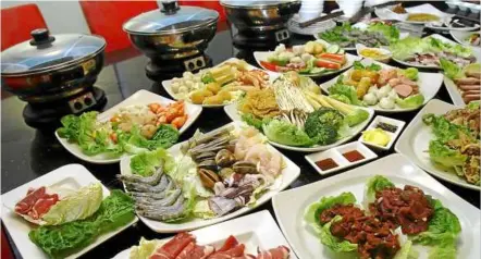  ??  ?? A wide variety of food awaits diners at Pak John steamboat.