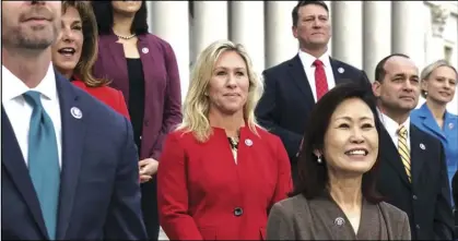  ?? ASSOCIATED PRESS ?? In this Jan. 4 photo, Rep. Marjorie Taylor Greene, R-Ga. (center) stands with other GOP freshmen during an event at the Capitol in Washington.