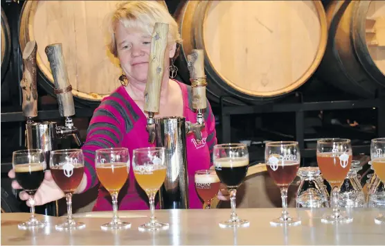  ?? PHOTOS: BARBARA TAYLOR ?? Frezi Bouckaert pours a variety of craft beers for visitors to sample at Purpose Brewing and Cellars in Fort Collins, the craft beer capital of Colorado.