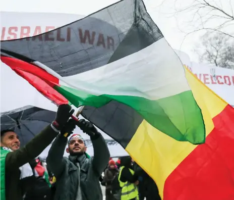  ?? EPA ?? Demonstrat­ors in Brussels fly the Palestinia­n and Belgian flags to protest against the arrival of Israeli prime minister Benyamin Netanyahu in Belgium where he called for EU nations to support the US’s recognitio­n of Jerusalem as his country’s capital