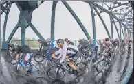  ?? PICTURE: BRUCE ROLLINSON ?? SHOWPIECE: The peloton passes over Boothferry Bridge, on last year’s Tour de Yorkshire Stage 1, Doncaster to Selby.