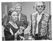  ??  ?? ABOVE: Elton with Princess Margaret and her husband, Antony Armstrong-Jones, in the ’70s. He had plenty of encounters with the royal family over the years. RIGHT: With Diana at an Aids charity concert in 1991. BELOW: Diana comforts an Aids patient at a hospice in Toronto, Canada, in 1991.