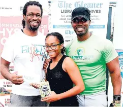  ??  ?? Winner of the cardio challenge, Ishcah Browne, getting her Active fitness band, courtesy of Asafa Powell, from TrainFit’s Stokely Rose (right) and Marvin Gordon from The Gleaner’s Fit 4 Life.