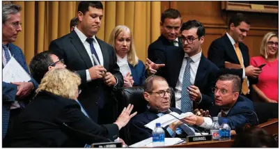  ?? The New York Times/DOUG MILLS ?? House Judiciary Committee Chairman Jerrold Nadler (seated, center) is surrounded by people Tuesday as ranking member Doug Collins (right) argues about rules near the end of questionin­g of Corey Lewandowsk­i, President Donald Trump’s former campaign manager.
