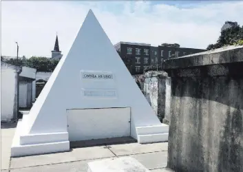  ?? Beth J. Harpaz The Associated Press ?? Nicolas Cage is alive and well, but he owns this gleaming pyramid-shaped tomb.