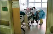  ?? PTI ?? Nurses assist COVID-19 patient Osmarino Lima on a mid care room at the Dr. Ernesto Che Guevara hospital in Marica, Brazil