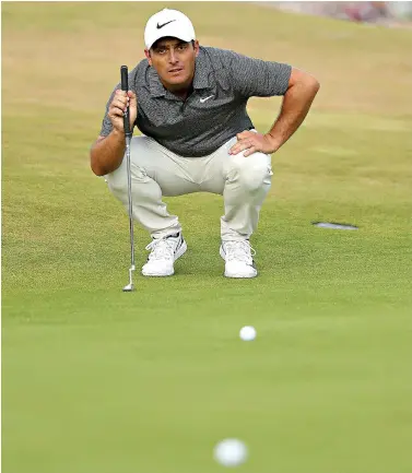  ?? AP Photo/Peter Morrison ?? ■ Francesco Molinari prepares to putt during the final round of the 147th British Open on Sunday in Carnoustie, Scotland.