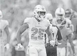  ?? JOHN MCCALL/SOUTH FLORIDA SUN SENTINEL ?? Dolphins cornerback Xavien Howard celebrates after making a big stop against the Bears at Hard Rock Stadium on Oct. 14, 2018.