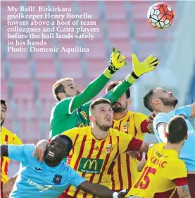  ??  ?? My Ball! Birkirkara goalkeeper Henry Bonello towers above a host of team colleagues and Gzira players before the ball lands safely in his hands Photo: Domenic Aquilina