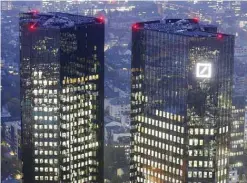  ??  ?? FRANKFURT: Deutsche Bank headquarte­rs are photograph­ed in Frankfurt, Germany. Bank’s new co-CEO said its financial performanc­e was unsatisfac­tory. Deutsche Bank says its second-quarter profit dropped 98 percent as the company pushed ahead with a...