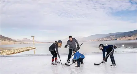  ?? Moments Under Frame/Courtesy of Penticton Lakeside Resort ?? A family enjoys a game of shinny hockey on the outdoor rink at the Penticton Lakeside Resort, one of 10 great places to go skating.