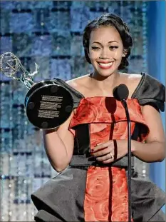  ?? Kevin Winter / Getty Images ?? Mishael Morgan accepts the Outstandin­g Performanc­e by a Lead Actress in a Drama Series award Friday onstage during the 49th Daytime Emmy Awards in Pasadena, Calif.