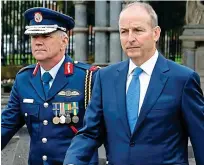  ?? ?? looking presidenti­al: Enda Kenny with Prince Harry and, right, Micheál Martin with Lieutenant General Seán Clancy