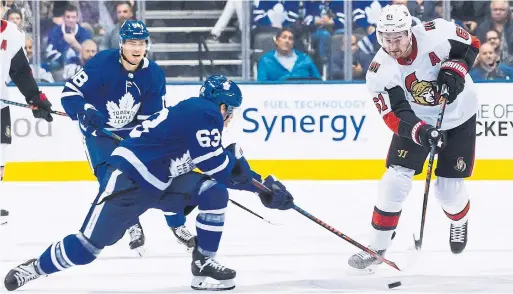  ?? CHRIS YOUNG THE CANADIAN PRESS ?? Leaf Tyler Ennis, with his mom and dad in the house, tries to get a stick on Mark Stone’s attempt at an empty-netter, which found the mark to cap the Sens’ scoring.