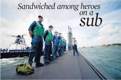  ?? PHOTOS BY JOE CAVARETTA/STAFF PHOTOGRAPH­ER ?? Crew members of the USS New Hampshire line up as the nuclear submarine comes into Port Everglades on Monday for Fleet Week.