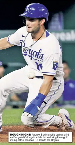  ??  ?? ROUGH NIGHT: Andrew Benintendi is safe at third as Rougned Odor gets a late throw during the eighth inning of the Yankees’ 8-4 loss to the Royals.