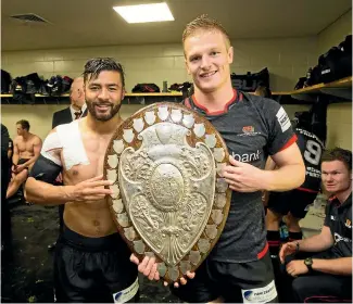  ?? PHOTO: PHOTOSPORT ?? Johnny McNicholl (right), pictured with Richie Mo’unga after Canterbury lifted the Ranfurly Shield off Waikato last month, is hoping his performanc­es with the Scarlets club could lead to selection for Wales.