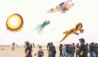  ?? — Sarawak Public Communicat­ions Unit photo ?? Some of the kites in flight during KIKF 2024 at Tanjung Kembang Beach.