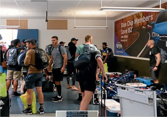  ??  ?? Highlander­s players, including assistant coach Tony Brown, left, arrive in Dunedin from Argentina before heading off into 14 days of self-isolation.