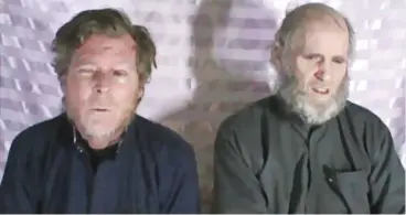  ??  ?? This file photo shows Tim Weeks (left) of Australia and Kevin King of America under Taliban hostage