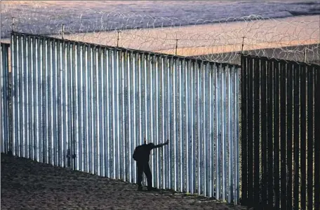  ?? Gary Coronado Los Angeles Times ?? DELAYS processing millions of visas, work permits, green cards and naturaliza­tion petitions, as well as cases languishin­g in immigratio­n courts, are so severe that experts say they can’t be resolved without significan­t reforms. Above, the U.S.-Mexico border in Tijuana.