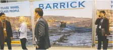  ?? CHRIS HELGREN/REUTERS FILES ?? Barrick says deals are more attractive amid gold’s rise. Above, participan­ts at a mining conference in Toronto.