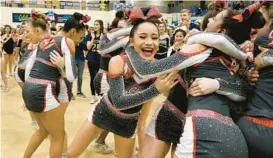  ?? PAUL W. GILLESPIE/BALTIMORE SUN MEDIA ?? Glen Burnie cheerleade­rs celebrate after being announced as the Class 4A winter state champion on Tuesday at Harford Community College’s APGFCU Arena.